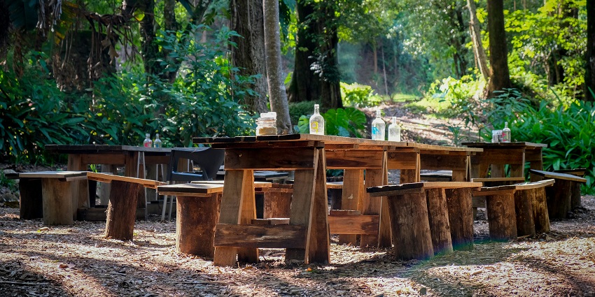 Wooden Tables and chairs here amidst the gorgeous natural beauty.