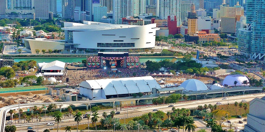 An aerial view of Ultra Music Festival in Miami with a stage and crowd surrounded