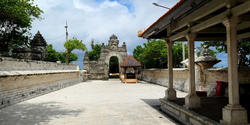 An empty courtyard near Uluwatu Temple, a place to visit on the Bali travel guide.
