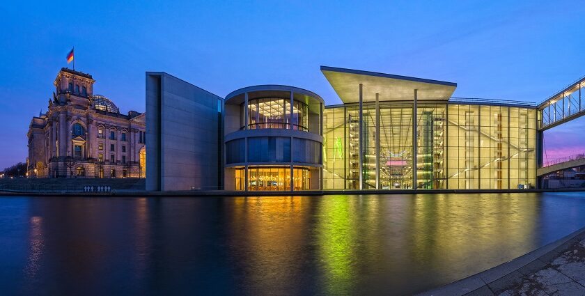 Berlin Mitte with historical and modern buildings facing the spree river during blue hour