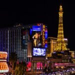 An image showcasing a vibrant Las Vegas Strip with illuminated hotels and bustling traffic.