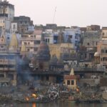 A group of people perform last rites at a cremation ground on the bank of the Ganges in Varanasi, UP.