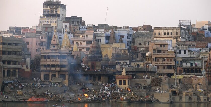 A group of people perform last rites at a cremation ground on the bank of the Ganges in Varanasi, UP.