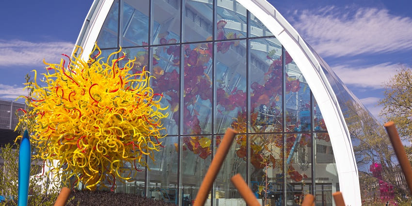 Image showing a large glasshouse with a natural-looking vegetation dummy and a clear sky