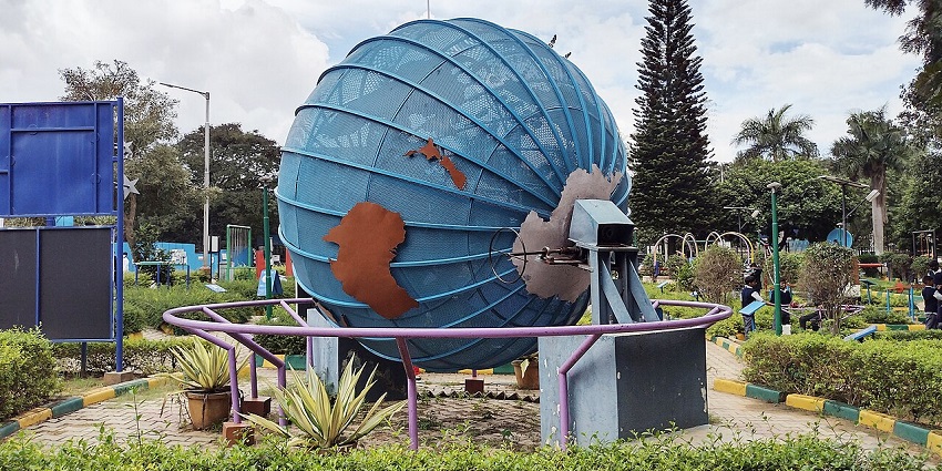 Beautiful Image of the Jawahar Planetarium surrounded by lush green Trees