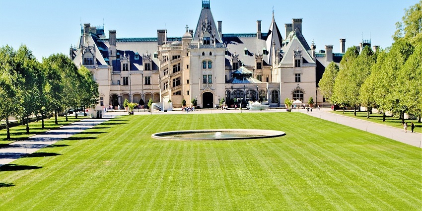 An image of the Biltmore House with lush lawns, trees, to celebrate valentines day in the USA.