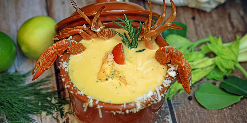 An image of a plate of delicious lobster soup with vegetables, perfect for a Valentine's Day party in Seattle