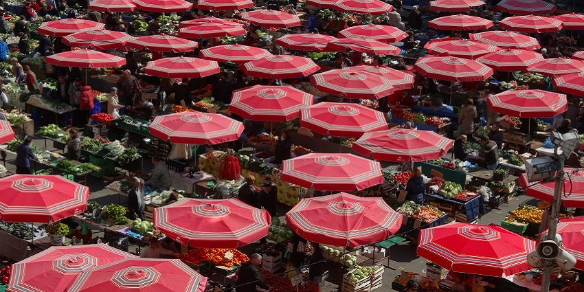 A colourful and dynamic view of Dolac Market in Zagreb, full of fresh fruits, and vegetables.