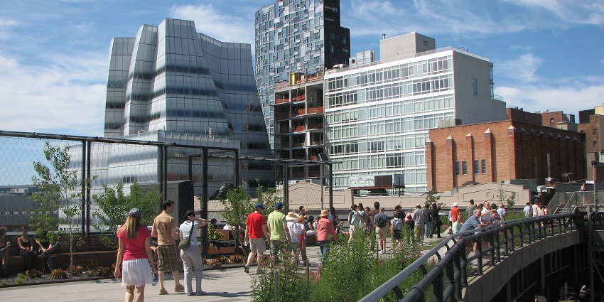 The image of people walking in the park with greenery, one among the best things to do in NYC for valentines day.