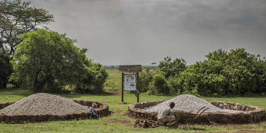 A man sitting near the ashes in the Ivory burning site at the National Park of Nairobi.