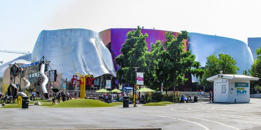 Outside view of Museum of Pop Culture with few people enjoying creating a lively environment