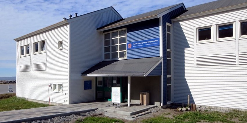 A panoramic view of the Greenland National Museum featuring wooden building structures.