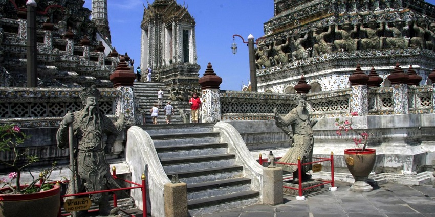Picturesque view of Iconic riverside temple with intricate details in Bangkok