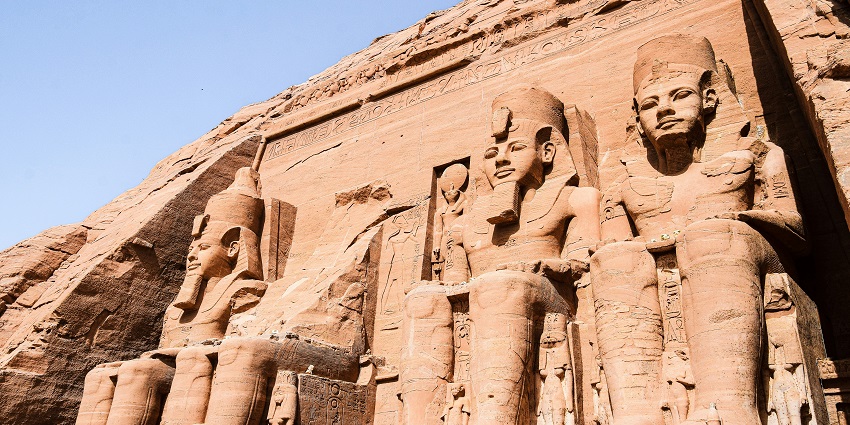 Close-up view of the Abu Simbel Temples on a clear day featuring ancient Egyptian artworks