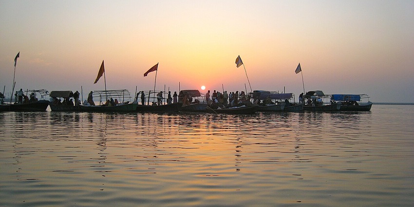 Scenic image of beautiful Triveni Sangam, where boats are floating on river