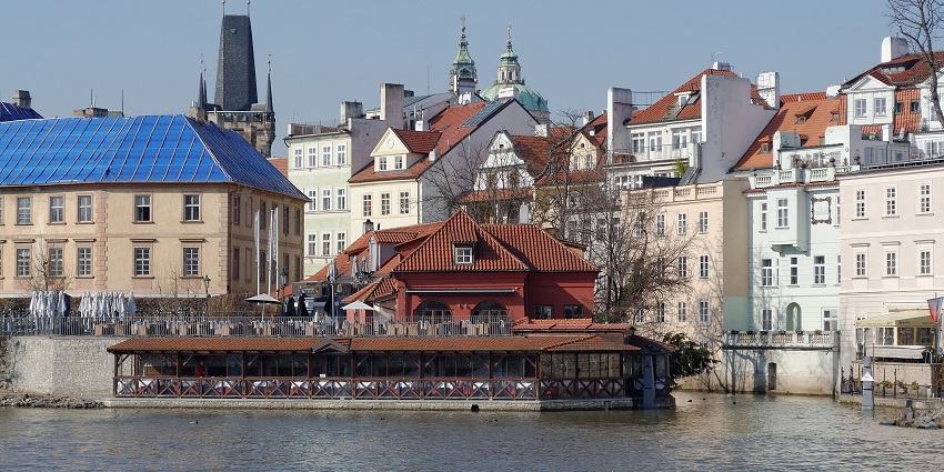Enjoy the scenic boat cruise on the Vltava River with views of Prague landmarks.