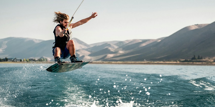 A picture of a person wakeboarding, one of the best water sports in Maharashtra.