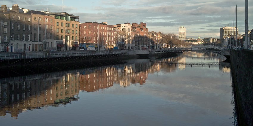 An image showing a view of the River Liffey, surrounded by the streets of Dublin.