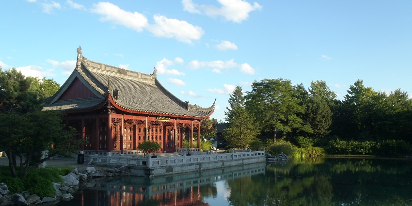 Jardin Botanique de Montréal with a Japanese-style shrine, surrounded by greenery and lake