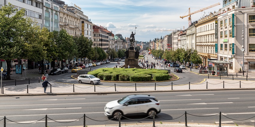 A view of Wenceslas Square, one of the top places to visit in Prague, is bustling with life.