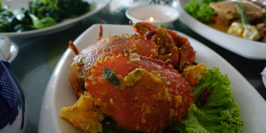 Image of crab food served on a table with lettuce on the side