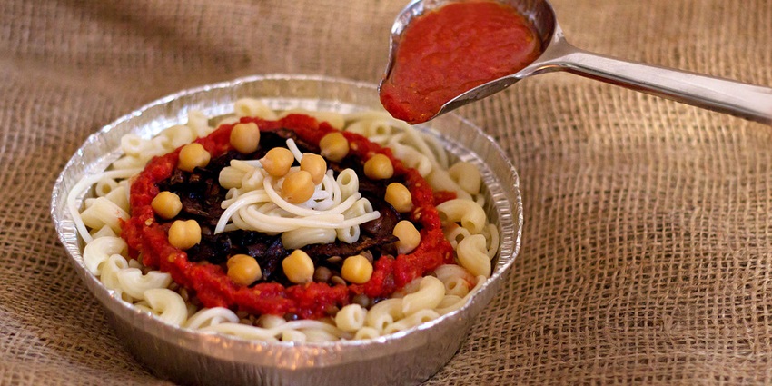 Savour the Egyptian dish - Koshari on your visit to the Grand Egyptian Museum.