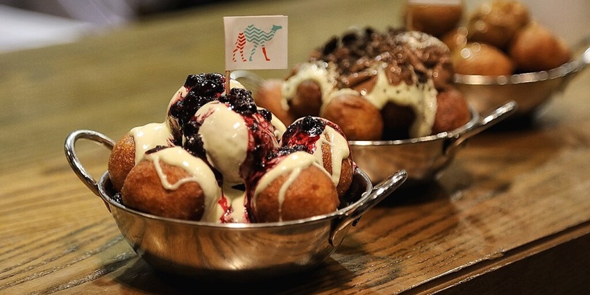 The Emirati snack Luqaimat is served with sugar syrup.