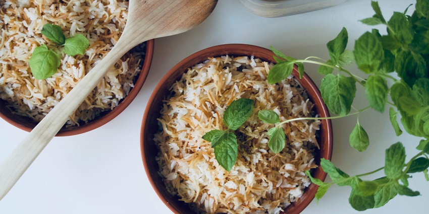 An image of a delicious spread of traditional Tamil dishes such as Pongal, sambar, and curd rice.