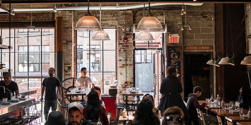 An image of a cosy coffee shop setting with inviting decor and freshly brewed coffee near Aga Khan Museum.
