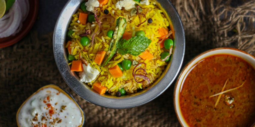 North Indian Biryani served with Dahi in a fine-dine restaurant in the city of Raipur