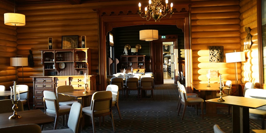An image showing a well-arranged dining area at a restaurant, offering a cosy atmosphere.
