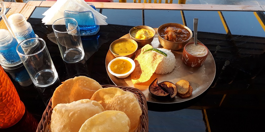 Image of food thali with variety of dishes served on a plate in Nainital, Uttarakhand