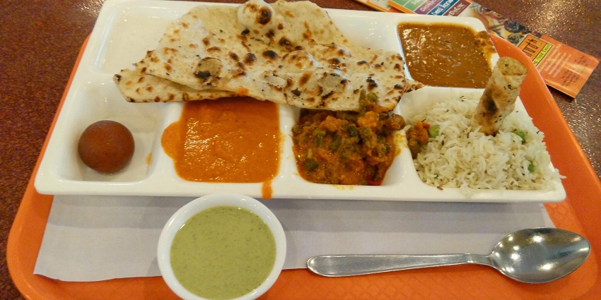 North Indian Veg Thali with chutney and papad to relish during your trip.
