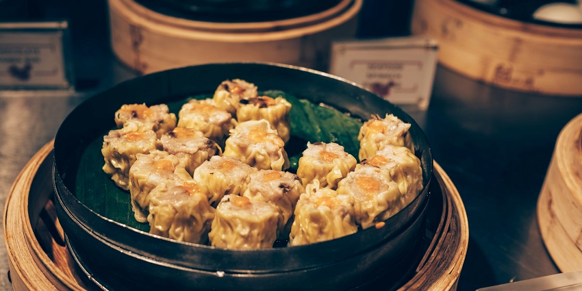 The Po Lin monastery’s vegetarian restaurant is a must-try, serving traditional dishes.