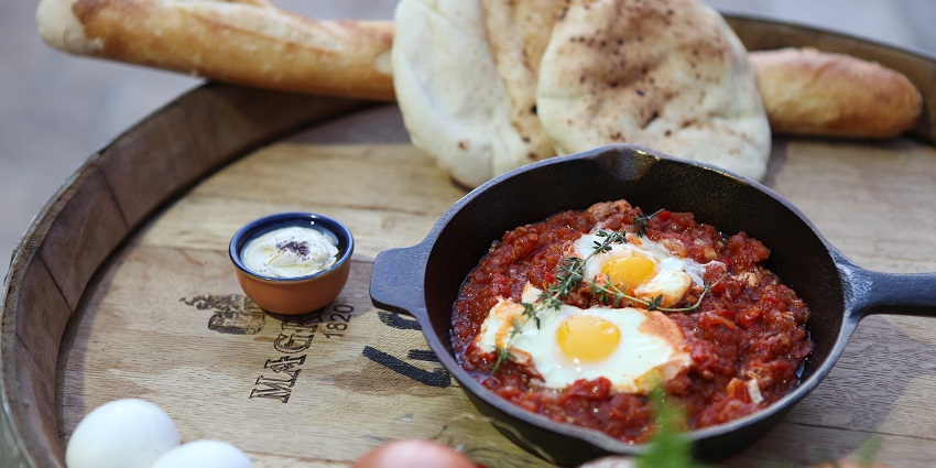 Dining near Qumran Caves offers Middle Eastern cuisine with desert views.
