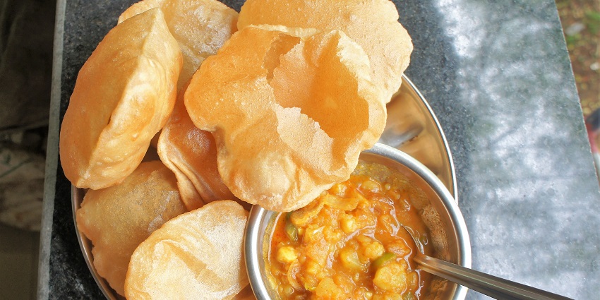 Rishikesh travel guide highlights the famous aalo puri, the traditional cuisine.