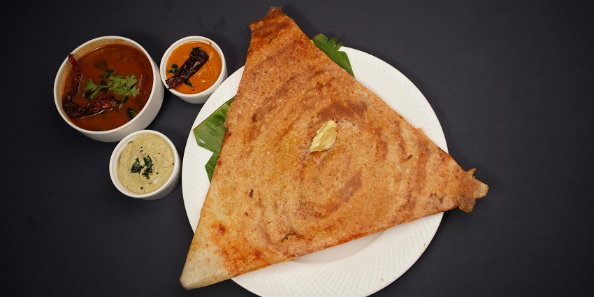 The traditional South Indian dish served with different sauces.