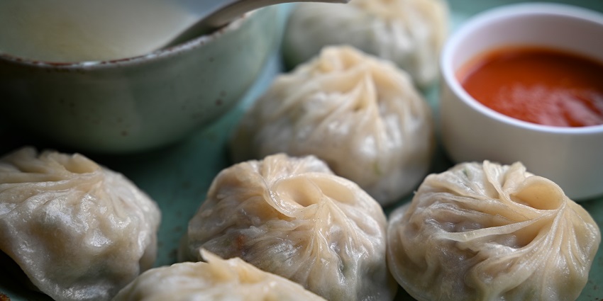 Tibetan cuisine, steamed momos served with sauce.