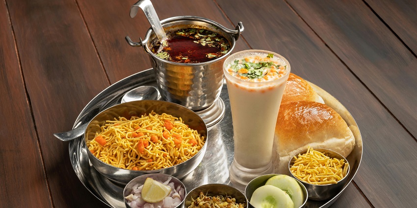 The traditional meal served on a tray showcasing blend of local Maharashtrian flavours.