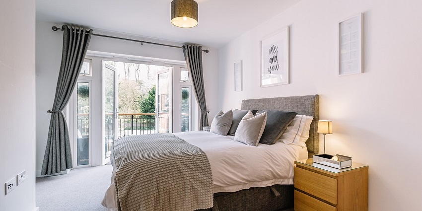 Elegant bedroom with stylish decor, soft lighting, and cosy ambience in a modern interior setting.