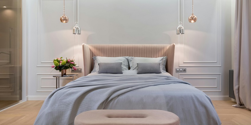 An image showing a comfortable hotel bedroom designed for relaxation and comfort.