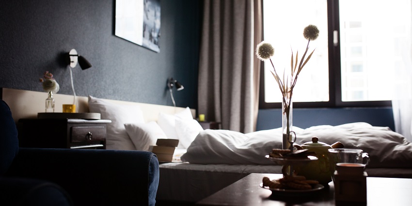 A well-decorated hotel room with modern furnishings, providing a comfortable and welcoming atmosphere