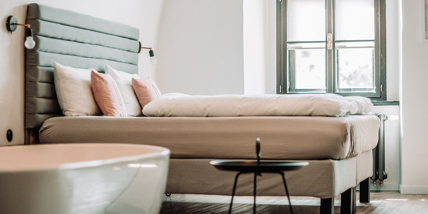 An image of a luxury bedroom with a white bedsheet best place near in British Columbia to relax.