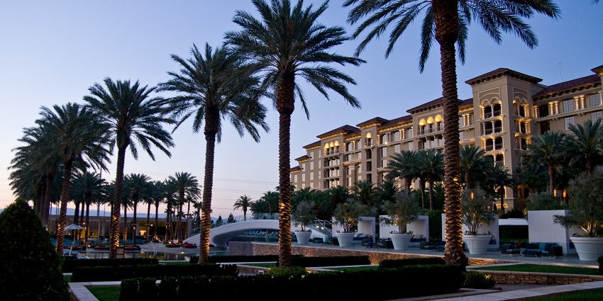 A picture of a pool area and northern hotel tower at the Green Valley Ranch resort.