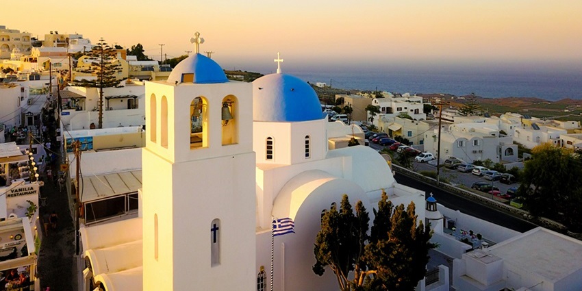 Witnessing a stunning sunset from Oia is one of the most magical things to do in Santorini