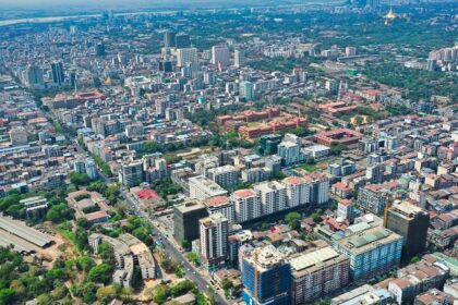 Yangon travel guide highlights the vibrant cityscape with golden pagodas, markets, and green parks.