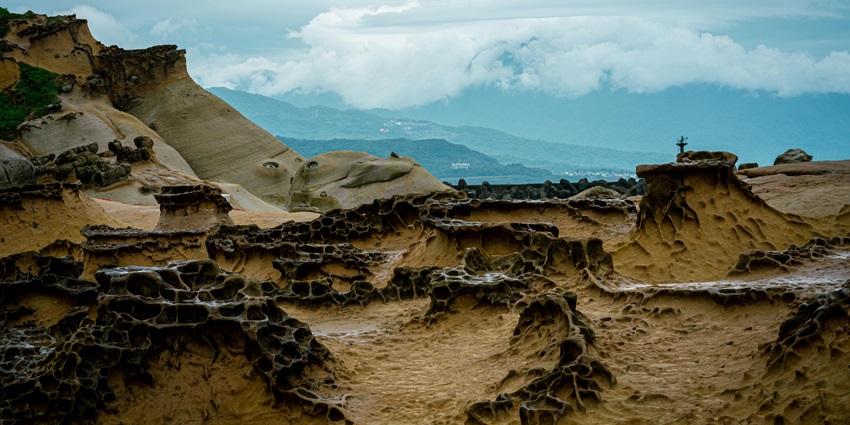 Yehliu Geopark in Taiwan features unique rock formations and bizarre landscapes.