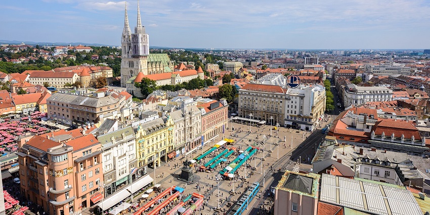 A beautiful view of Zagreb with historic landmarks, and green parks.