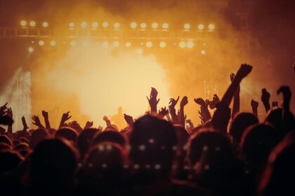 Crowd gathered at the Zanzibar music festival with a band performing on the stage