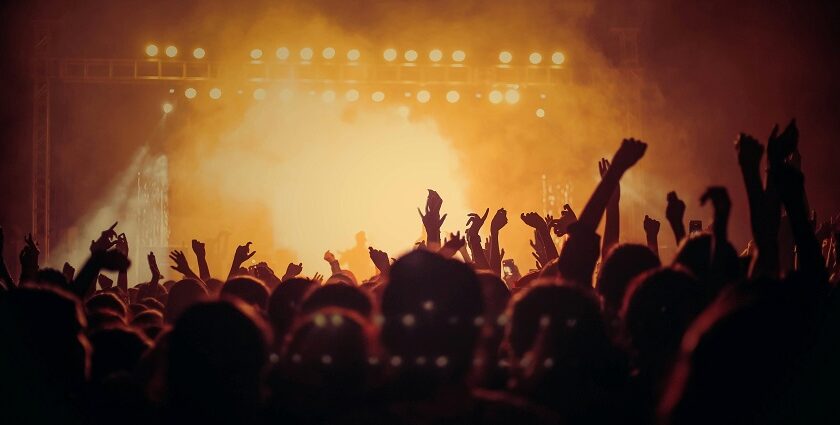 Crowd gathered at the Zanzibar music festival with a band performing on the stage